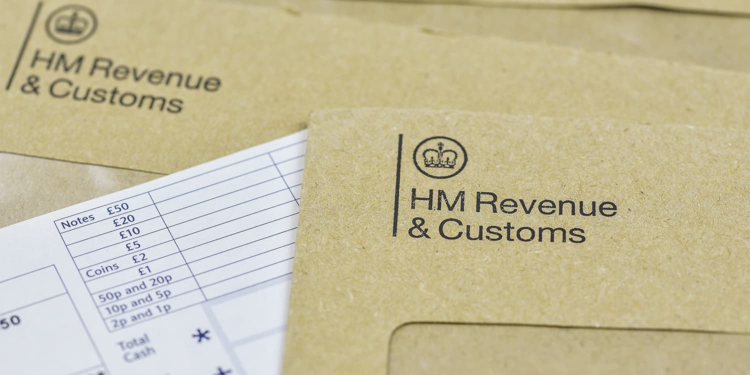 Official mail and brown envelopes featuring the HMRC logo, representing the type of correspondence that is delivered to a registered office address.