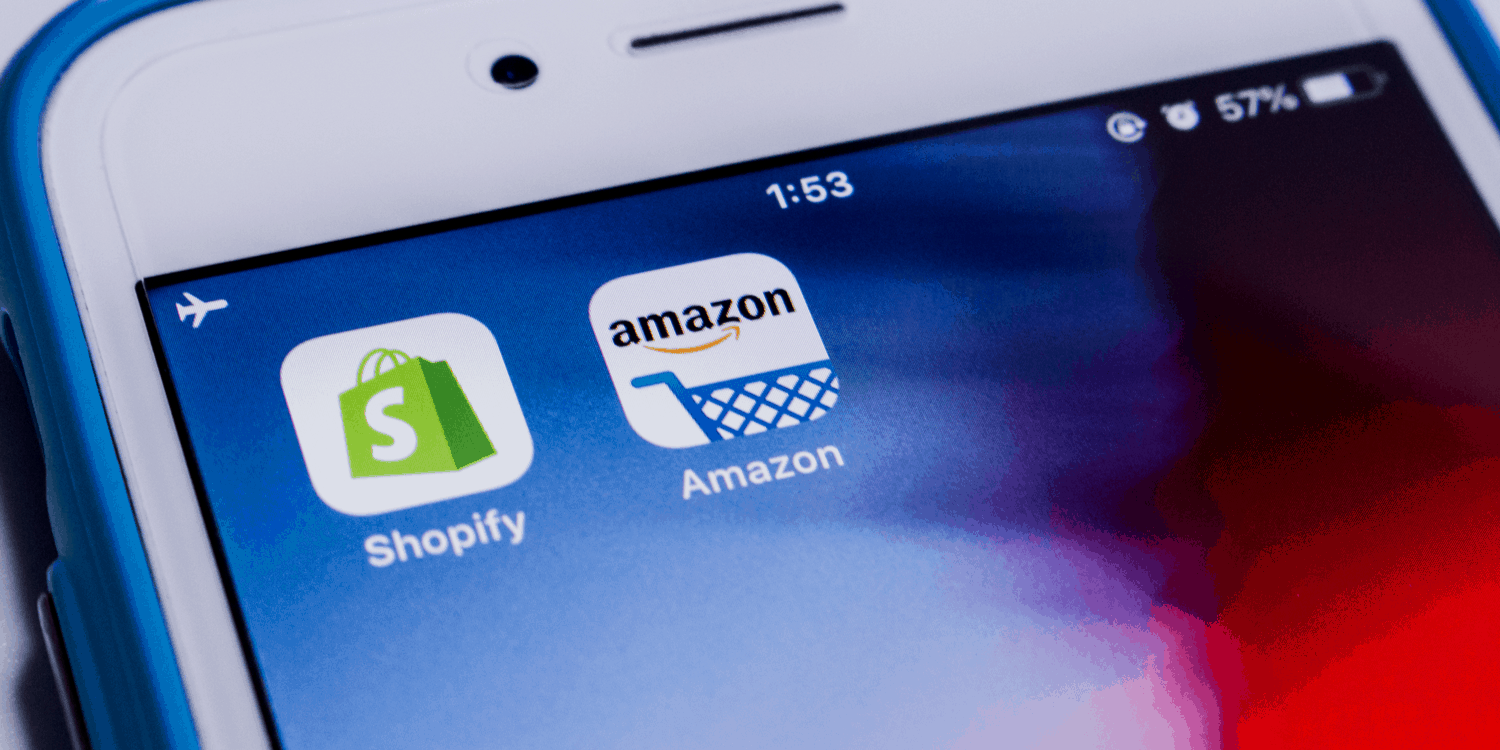 Mobile phone screen with Shopify and Amazon App icons displayed.