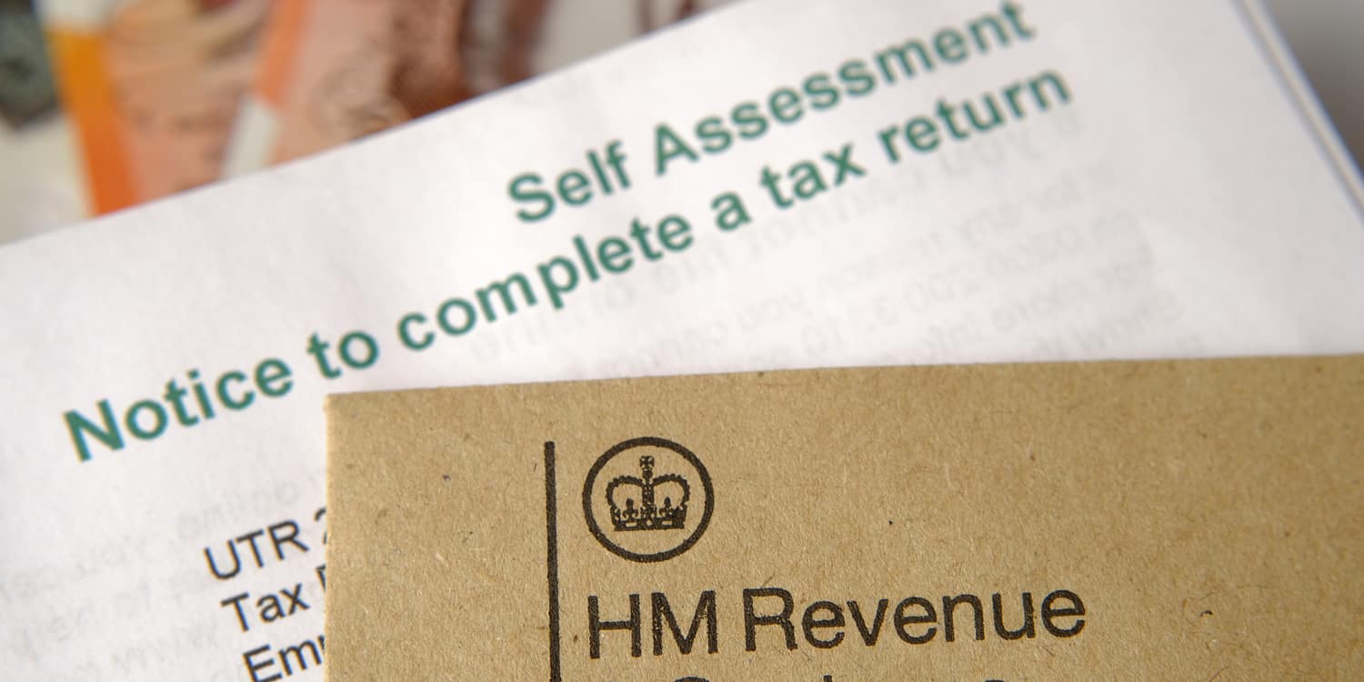 Image of Self Assessment tax return form and HMRC brown envelope.