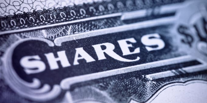 Close up image of a share certificate displaying the word SHARES.
