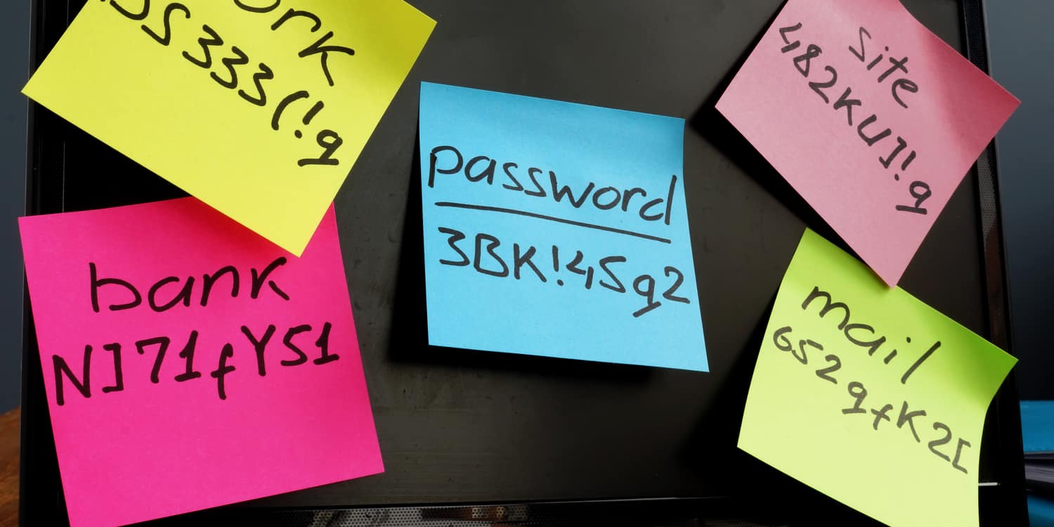 Post-it notes with passwords on computer monitor