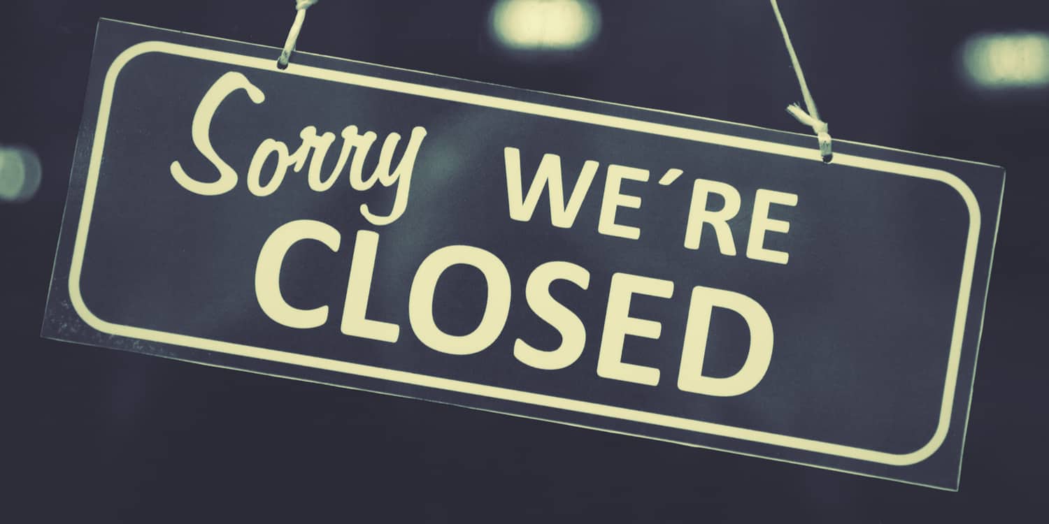 'Sorry WE'RE CLOSED' sign on shop window
