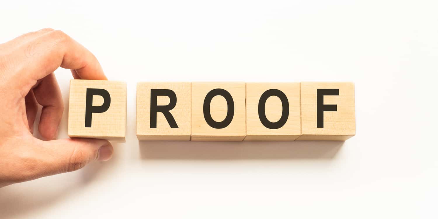 'PROOF' written with wooden blocks