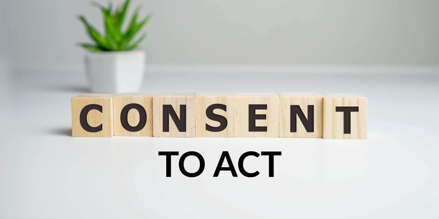 CONSENT - word from wooden blocks with letters, with 'TO ACT' below in black font, illustrating consent to act concept.