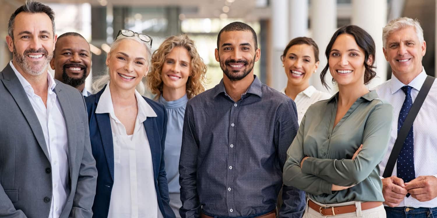 Portrait of a group of partners of an LLP in a modern office looking at camera.