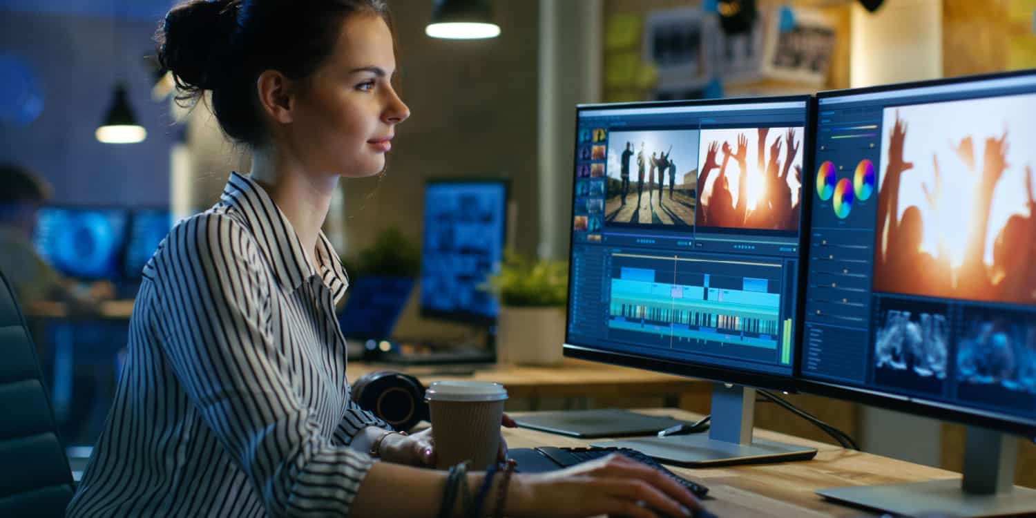 Female editing footage in her video production company.
