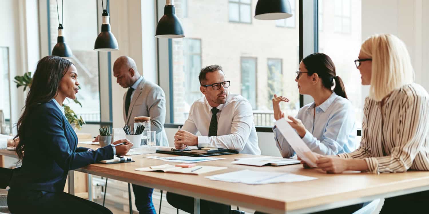 Group of business people holding a meeting in their office.