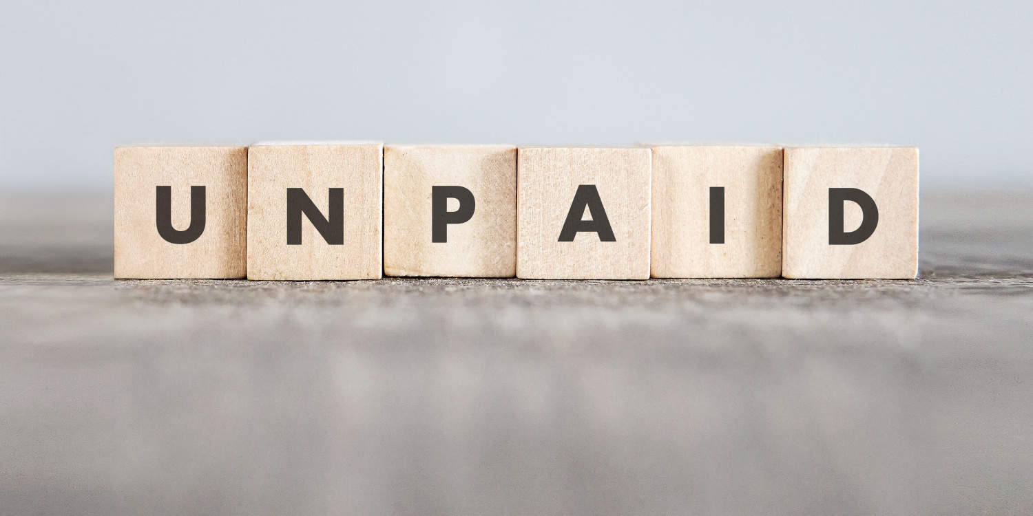 The word UNPAID made with wooden building blocks, illustrating the concept of nil-paid shares.