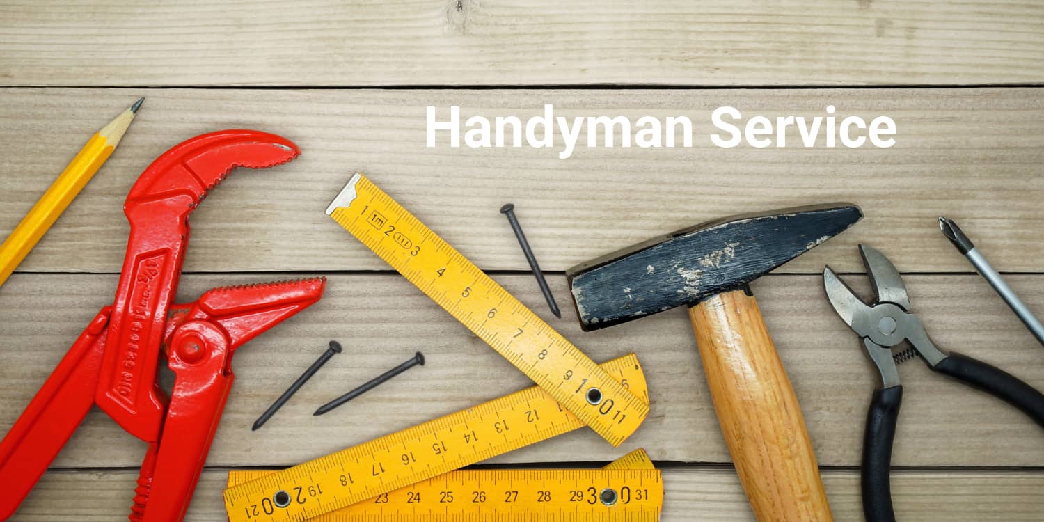 Handyman tools lying on a timber deck with a headline of 'Handyman Service' in white font.