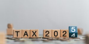 'Tax 2025' concept with wooden blocks and letters.