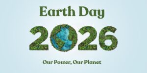 Earth Day 2026 poster showing "Earth Day" at the top and "Our Power, Our Planet" at the bottom; the numbers "2026" are made of green forest textures with the zero depicted as a blue ocean globe on a pale blue background.