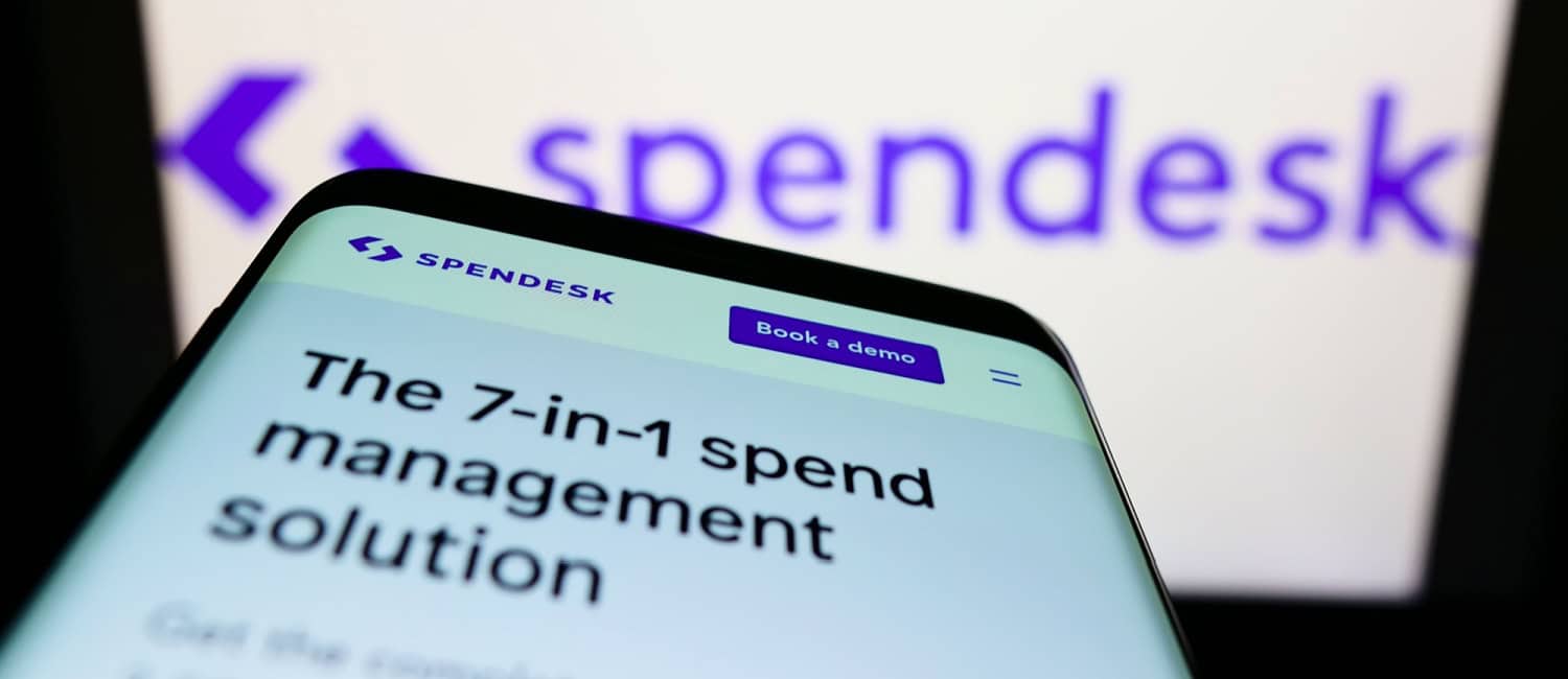 Smartphone with webpage of French fintech company Spendesk SAS on screen in front of the Spendesk business logo.