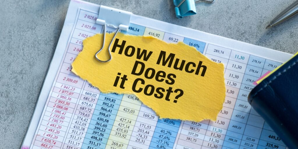 Financial spreadsheet with highlighted text reading “How Much Does it Cost?” representing a business calculating the cost of sales for accurate budgeting and financial planning