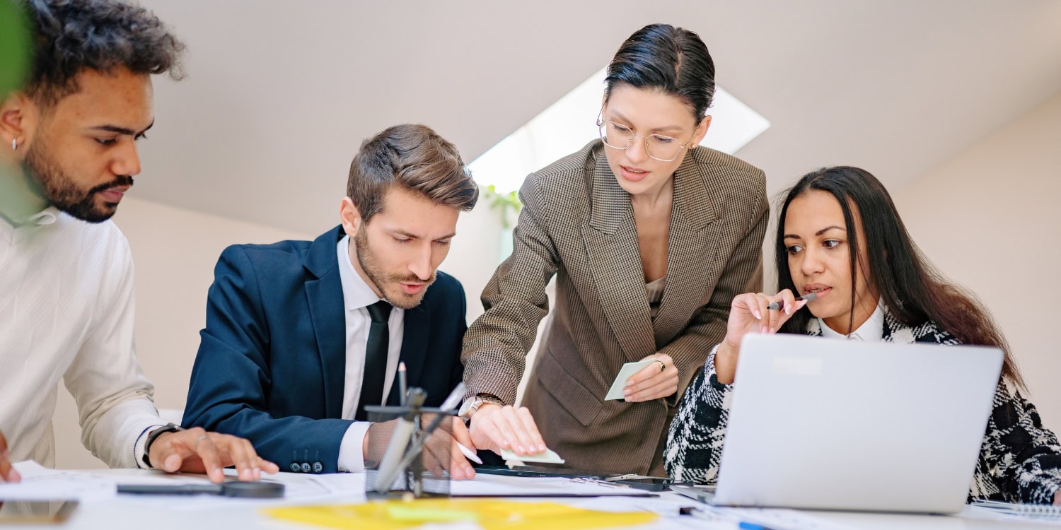 Company directors reviewing financial documents in an office meeting, illustrating fiduciary duties and corporate responsibilities