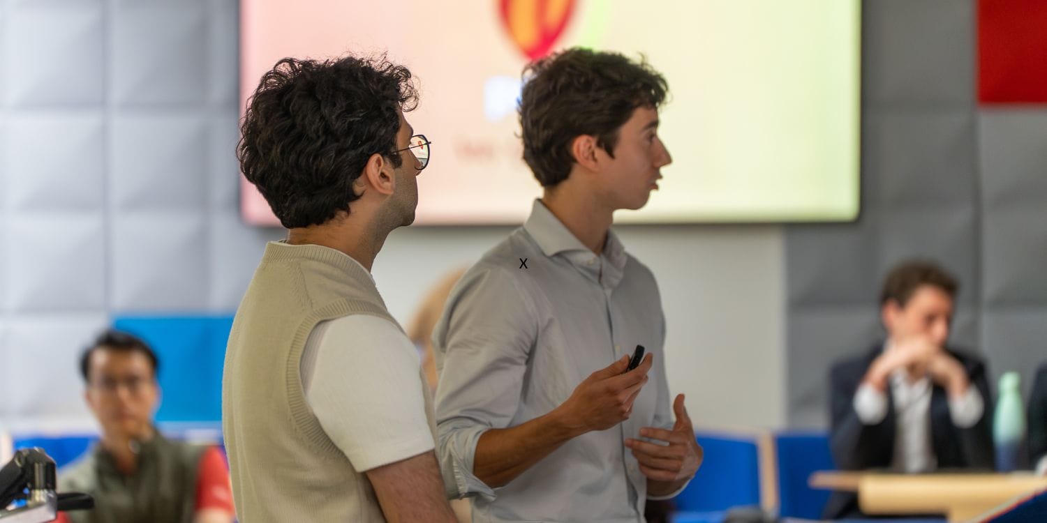The team from Pecan delivering their pitch in front of the judges.